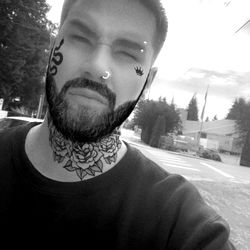 Tattooed Man in Coastal Boy Model Photo