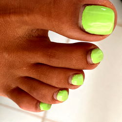 Stylish Neon Yellow Toenails on Feet