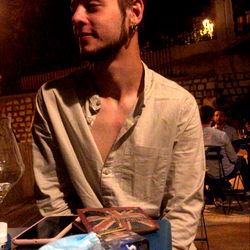 A Man Sitting at an Outdoor Cafe