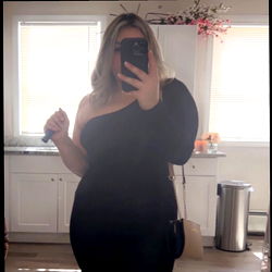 Full-body photo of woman in tight black outfit,