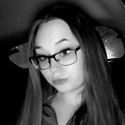 Young Lady with Glasses and a Flip Phone