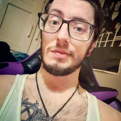 Xenovia, a Bearded Gamer with Tattoos