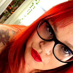 A woman with striking red hair