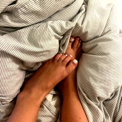 Intimate Close-up of Feet on Bed