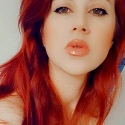 Red-haired woman with full lips and vibrant hair