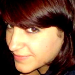 Young Adult Woman with Red Hair and a Necklace, Smiling