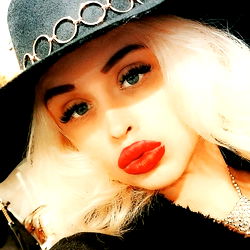 A Stylish Angela Black Photograph with Bold Red Lipstick and Fashionable Attire