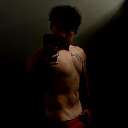 Fit Athletic Male Model Taking Mirror Selfie