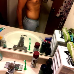 Frank Takem, A Bodybuilder Showcasing Fitness Progress in Mirror