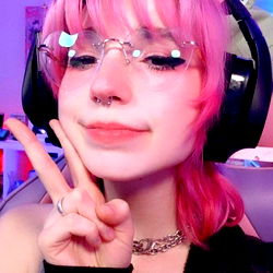 Pink-haired individual with cat ears