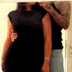 Model's Reflection in a Mirror with Fan