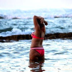 Blair, a beautiful woman in a bikini at the beach