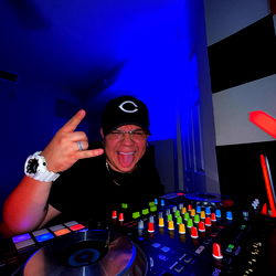 DJ Eme, a Miami-based artist, in the DJ booth