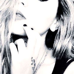 Chuny in a Black Tank Top, Striking a Pose