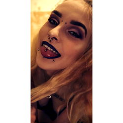 Vivid Tattoos on Model with a Piercing