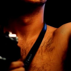 Onlyfans D: A Shirtless Photographer in a Room with Cameras