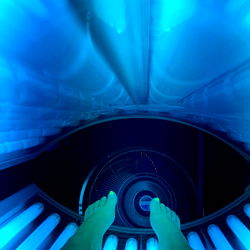 Model Sophie in a Tanning Booth