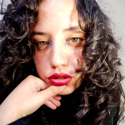 Model with curly hair posing for OnlyFans