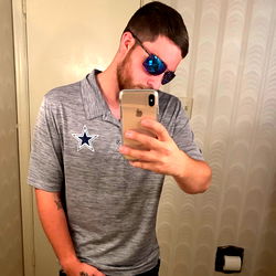 Austin, a Fans Model Taking an Elegant Selfie in a Bathroom Mirror