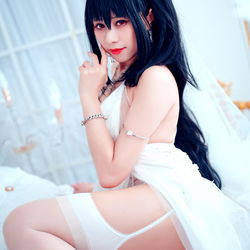 Enakaaa615, a striking OnlyFans model in a white dress and black lingerie