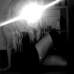 A captivating OnlyFans model, Viviana, posing in a stylish outfit and long hair. Her image evokes an atmosphere of allure and confidence.