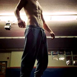 Shirtless Guy with Tattoo in Gym