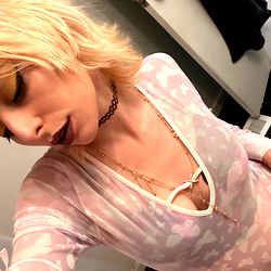 Horror Cakez, a makeup artist in character on OnlyFans, taking a selfie