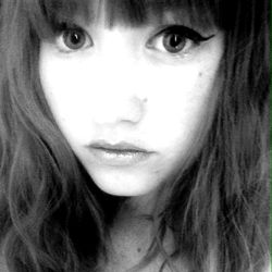 Female model posing for the camera with a neutral expression