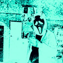 Casually Dressed Individual in Mask Photo