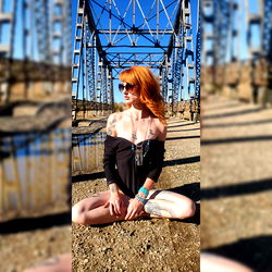 Miss Claire Voya Sitting in a Bridge