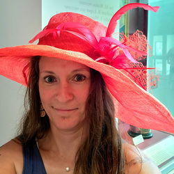 Angie Fauss, model from Illinois, showcasing her latest fashion accessory in a museum setting.