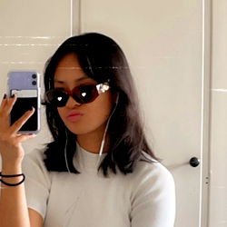 Fashionable Female in Sunglasses Sharing Her Style