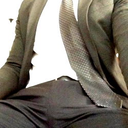 OnlyFans Model MrMixedX Sitting in a Suit and Tie