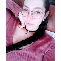 Young Female with Glasses in a Pink Top