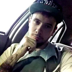 Model Azzkikr Posing in a Car