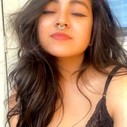 Model posing outdoors with sunglasses