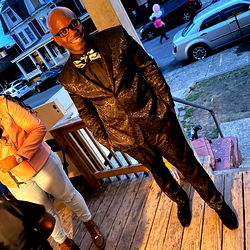 Dapper Gentleman in Formal Suit on Porch