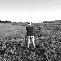 Solo in Field with Distant Skyline