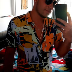 James in Hawaiian Print Shirt with Sunglasses and Shorts