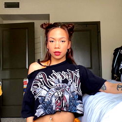 Nia Mae in a Daring Tie-Dye Shirt, Posed for OnlyFans