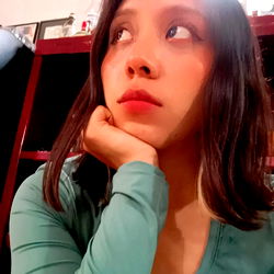 Model Softpop with a contemplative pose