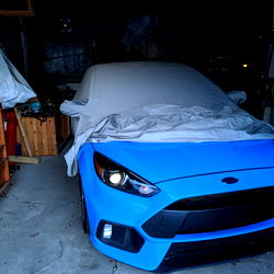 Vibrant Blue Ford Mustang Parked in Garage