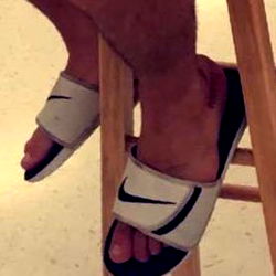 Onlyfans Model Showcasing White Slide Sandals