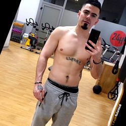 Fitness Model Striking a Pose in Gym