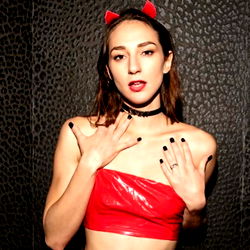 Andi Rose, a stunning model in red devil costume for OnlyFans