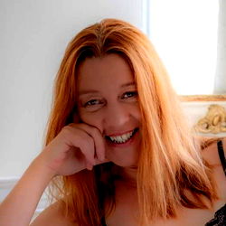 Joyful Woman with Red Hair and Bright Smile