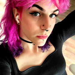 Stylish punk rocker with pink hair and nose piercing