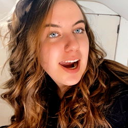 Woman with Wavy Hair and Curly Bangs