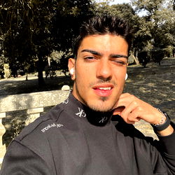 Fashionable Male Model Noah Noleto Posing in a Park