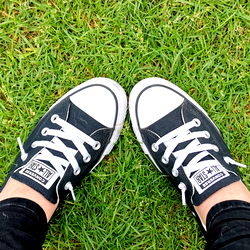 Black Converse Sneakers on Grass